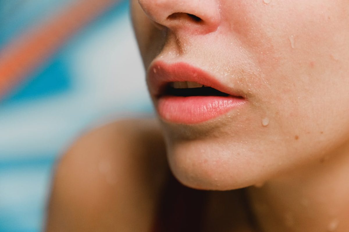 Close-up of clear, smooth skin after acne scar treatment with microneedling and skincare routine