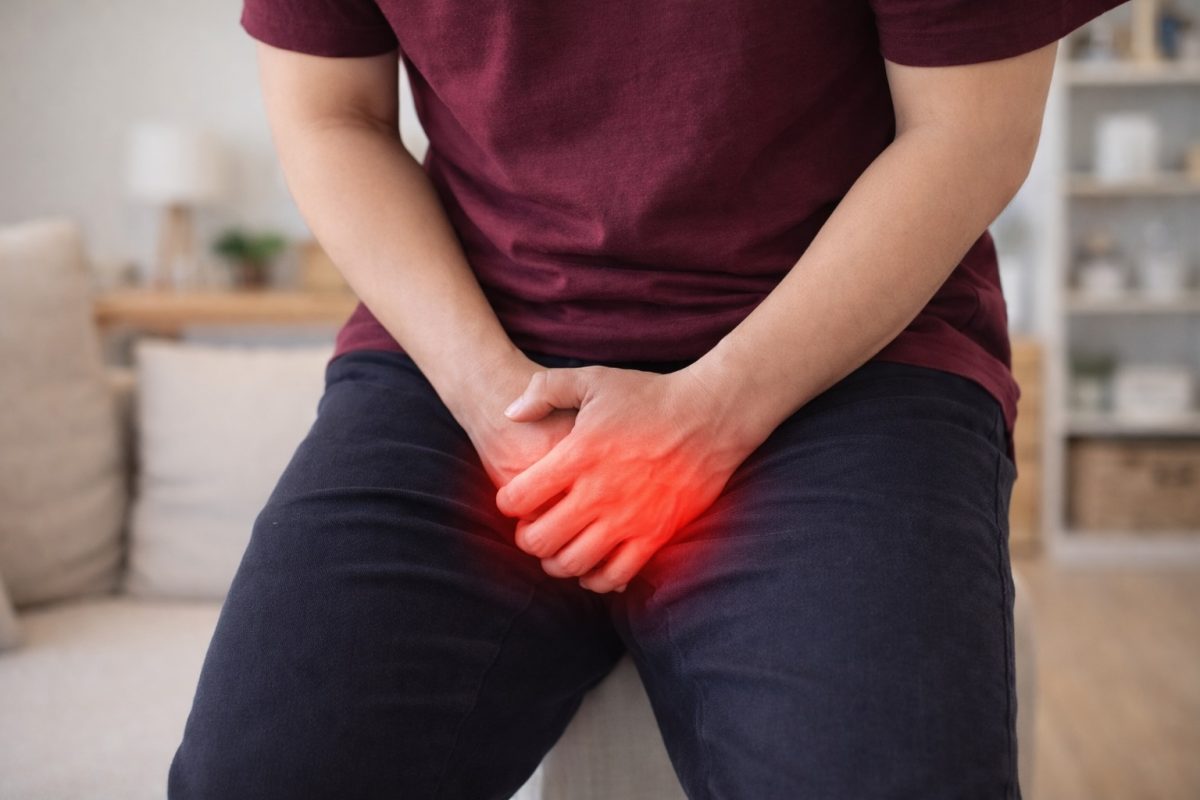 Seseorang yang menutup bahagian pangkal pahanya kerana sakit