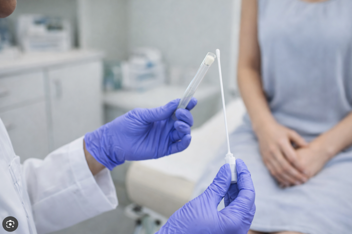 Healthcare professional preparing a swab test to diagnose a possible genital fungal or yeast infection in a clinical setting.