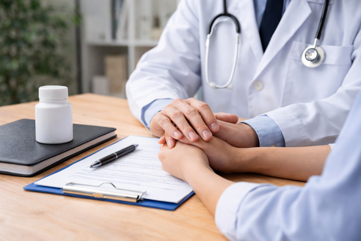 Doctor consulting patient with paperwork, discussing STD testing and genital health concerns.
