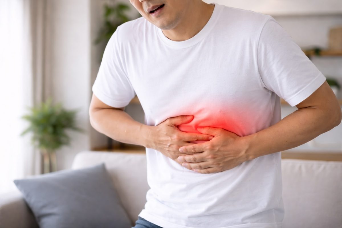 a man experiencing body discomfort