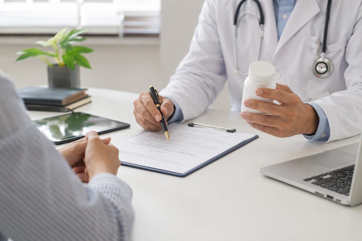 Doctor explaining STD medication treatment options while discussing recovery timeline with patient